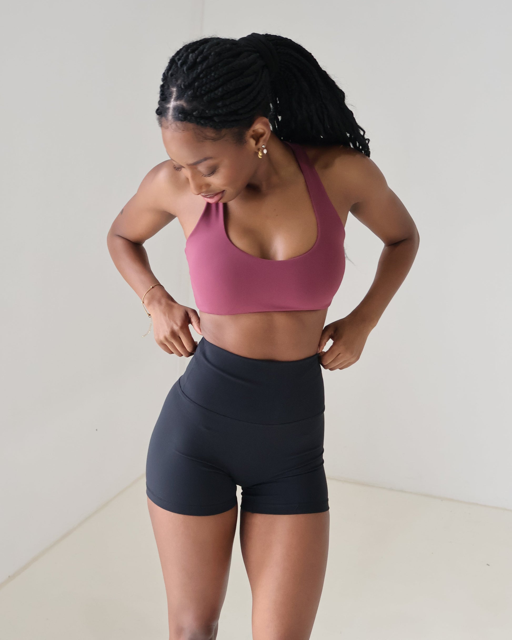 Athletic sports bra scoop neck slim racer design low cut but supportive, paired with shorts